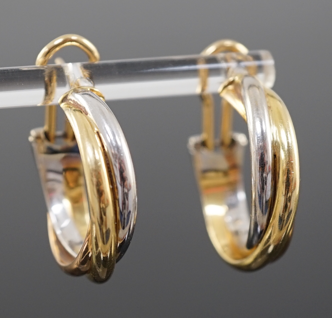 A modern pair of Cartier three colour 18ct gold Trinity earrings